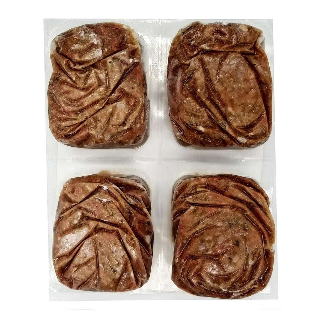 Red Dog Blue Kat Beef and Tripe for Dogs: Four frozen, vacuum-sealed ground beef patties with digestion-friendly tripe in a clear plastic blister pack.