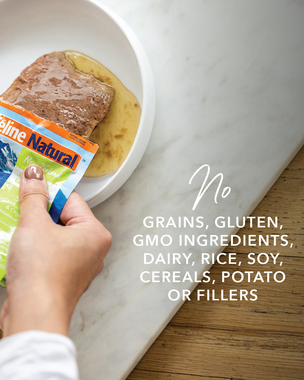 A person squeezes Feline Natural Pouches - Variety Box into a bowl, emphasizing its additive-free, high-protein, moisture-rich nutrition for cats.