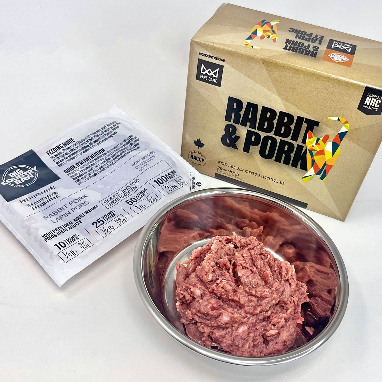 Fare Game Rabbit with Pork by Big Country Raw - $12.00/lb. Package and pouch beside a bowl of pink ground meat, showcasing premium cat food blend.