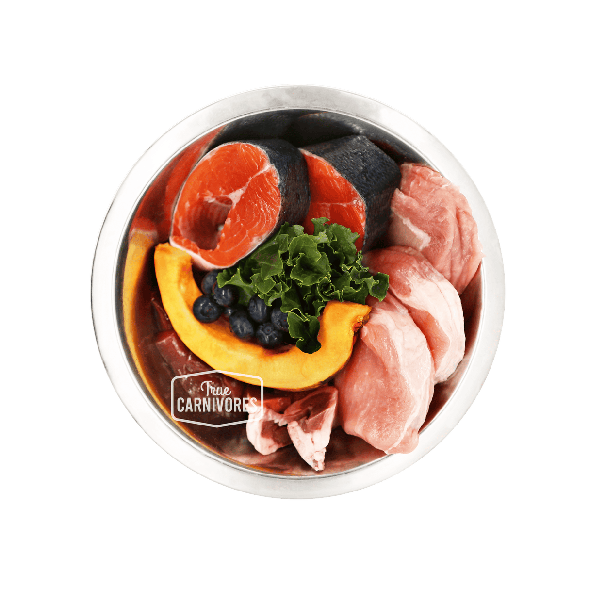 Stainless-steel bowl labeled “True Carnivores” with salmon steaks, red meat, pumpkin, blueberries, and kale, showcasing 100 Mile Raw Pork Dinner's locally sourced ingredients.
