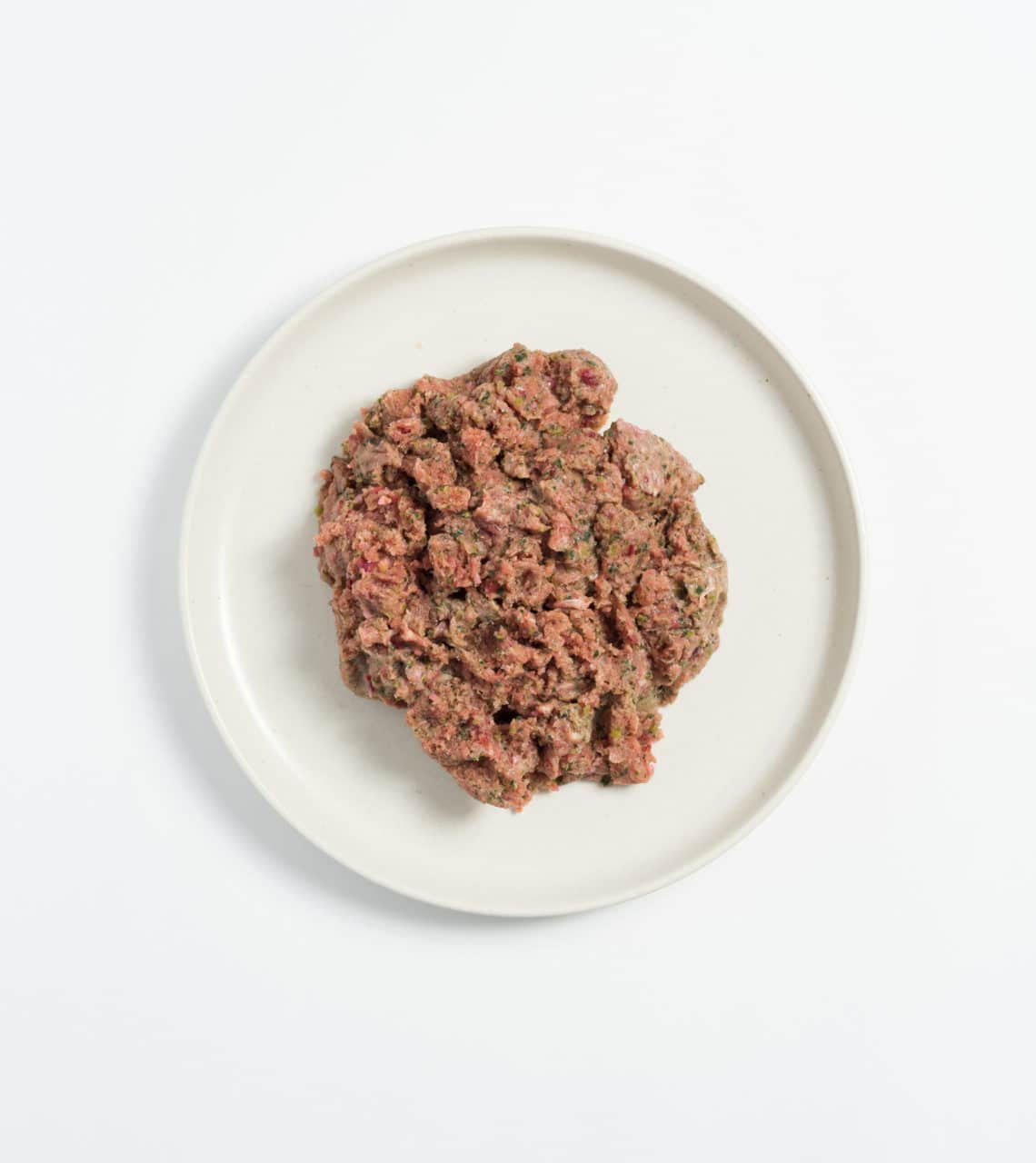 Rawbone Mixed Protein Rabbit Meal on a white plate, showcasing raw, minced meat with integrated organs and bone, ideal for raw feeding and portioning.