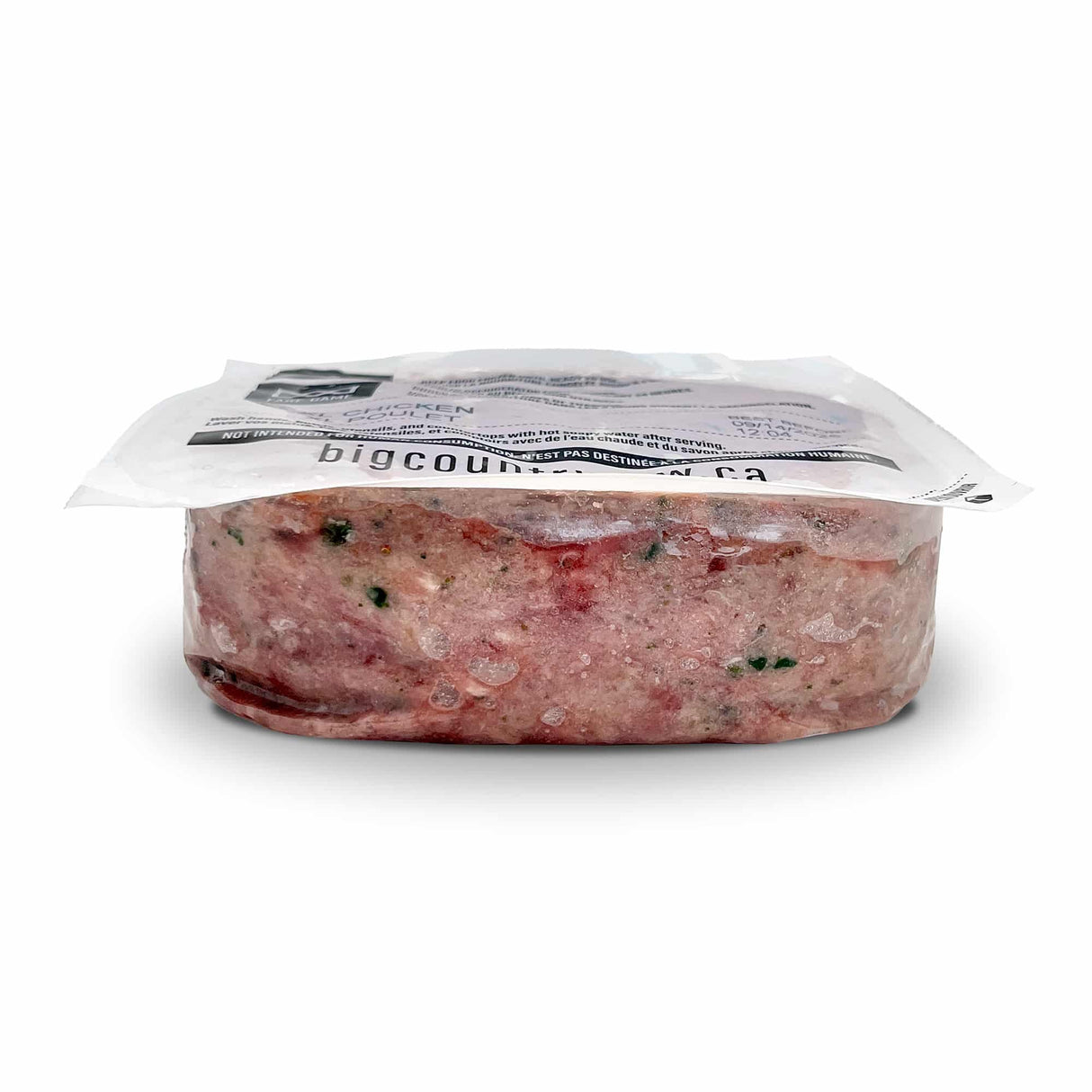 Big Country Raw XL Chicken in a vacuum-sealed pack, featuring coarsely ground chicken with herbs and veggies for large dogs’ balanced nutrition.