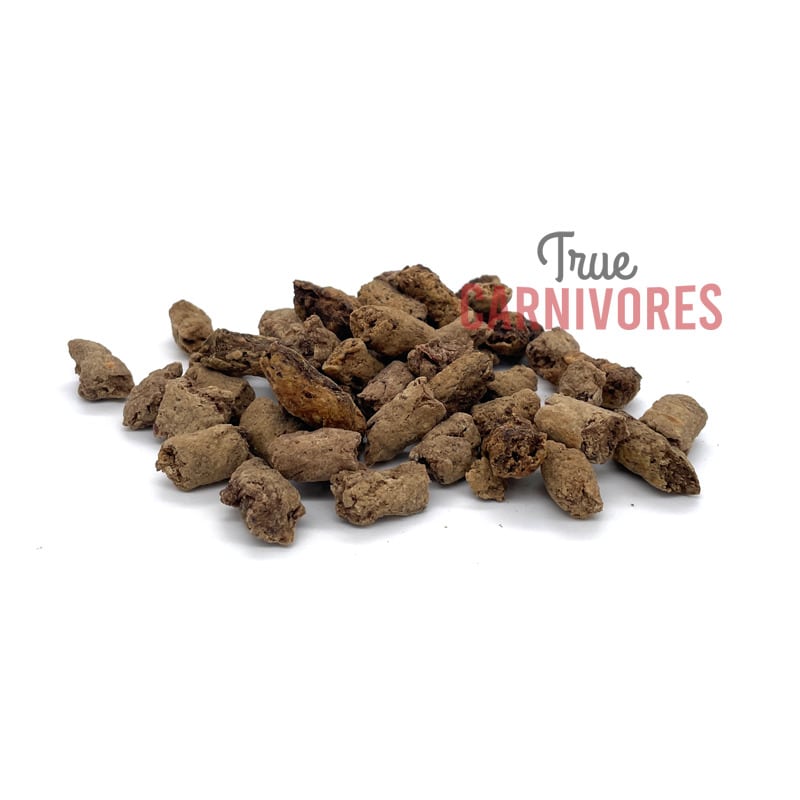 Carnivores Kitchen Crunchy Training Treats are small, irregularly-shaped brown pellets, perfect for training carnivorous pets with mess-free, high-protein rewards.