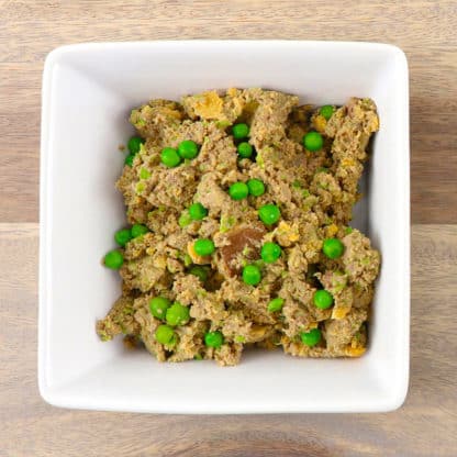 Tom & Sawyer Kangaroo: A bowl of crumbly, lean kangaroo mash with green peas, ideal for dogs needing a simple, lower-fat meal.