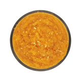 Top-down view of Back 2 Basics Digestive Blend, a round black container filled with bright orange pumpkin purée, rich in nutrients and fiber.
