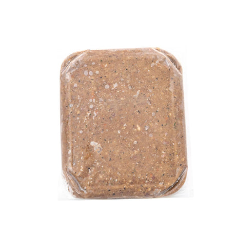 RDBK Everyday Raw Classic Harvest: Vacuum-sealed brown paste block resembling ground meat, combining pork, turkey necks, and salmon, packed for easy thawing and serving.