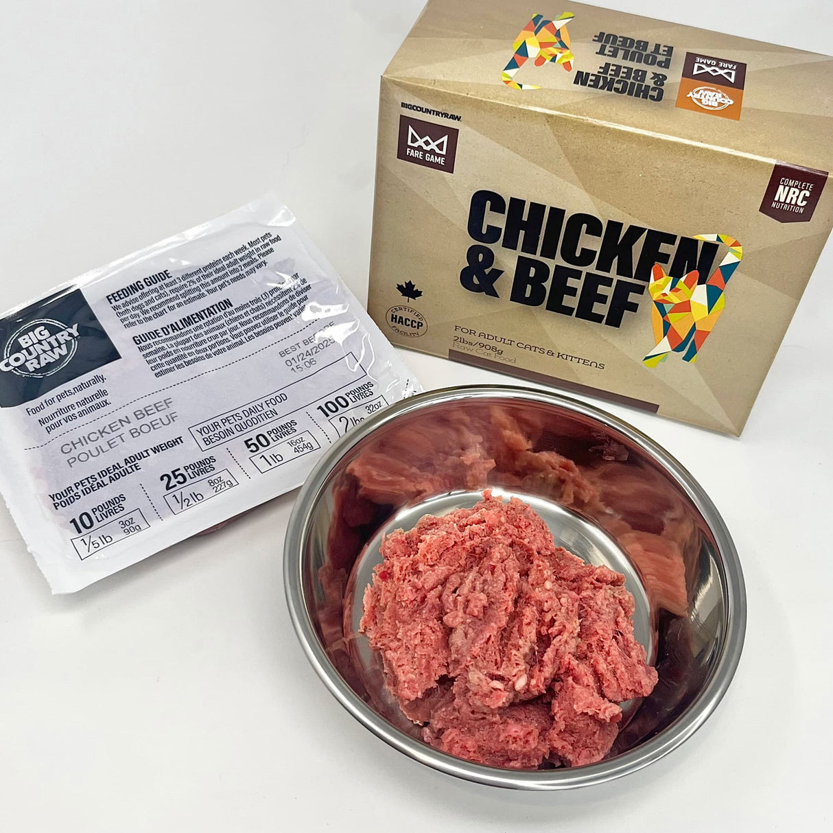 Fare Game Chicken & Beef by Big Country Raw, raw minced meat in a stainless-steel dish, with packaging showing feeding instructions, tailored for adult cats and kittens.