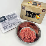 Fare Game Chicken & Beef by Big Country Raw, raw minced meat in a stainless-steel dish, with packaging showing feeding instructions, tailored for adult cats and kittens.