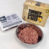 Fare Game Turkey and Sardines with Beef by Big Country Raw: Packaged raw cat food with visible thawed blend in a stainless-steel bowl.