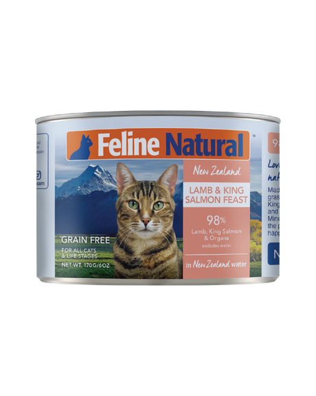 Feline Natural Canned Food for Cats featuring a tabby cat over New Zealand mountains, labeled Lamb & King Salmon Feast, 98% meat, grain-free.