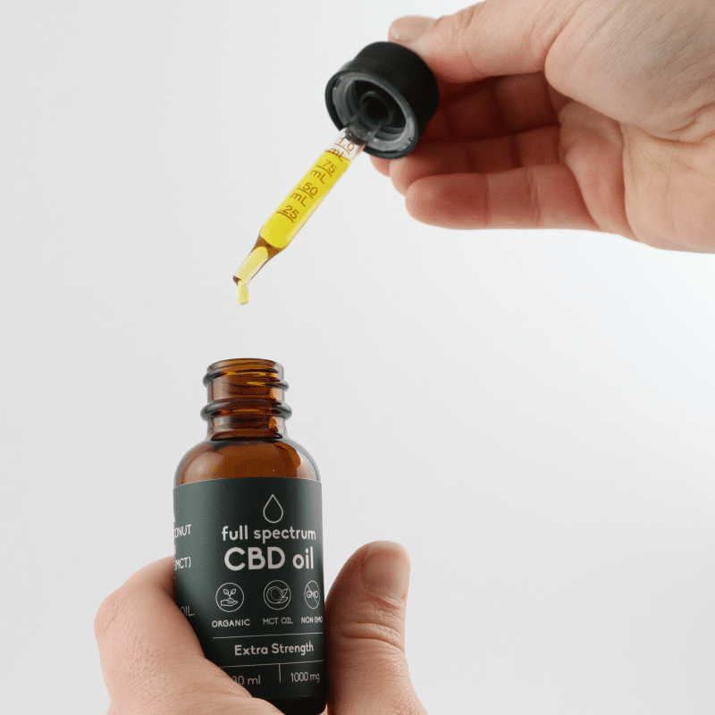 Carnivore Care Organic Full Spectrum Hemp Oil in amber bottle with dropper, highlighting extra strength 1000 mg formula for pets' holistic health.