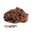 Back 2 Basics Pure Whole Prey Quail (Ground) - 1lb Portions; a mound of ground quail meat with feathers, ideal for pet meals.
