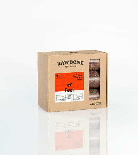 Rawbone Variety Box (Beef, Pork & Turkey) showing vacuum-sealed raw meals for dogs through a die-cut window, labeled as premium, human-grade, and nutritionally balanced.
