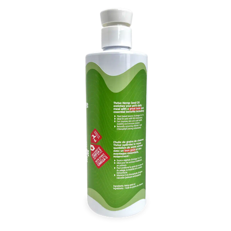 Thrive Hemp Seed Oil bottle with green label, highlighting its benefits as a plant-based omega source for pets, supporting skin, coat, joint, and immune health.