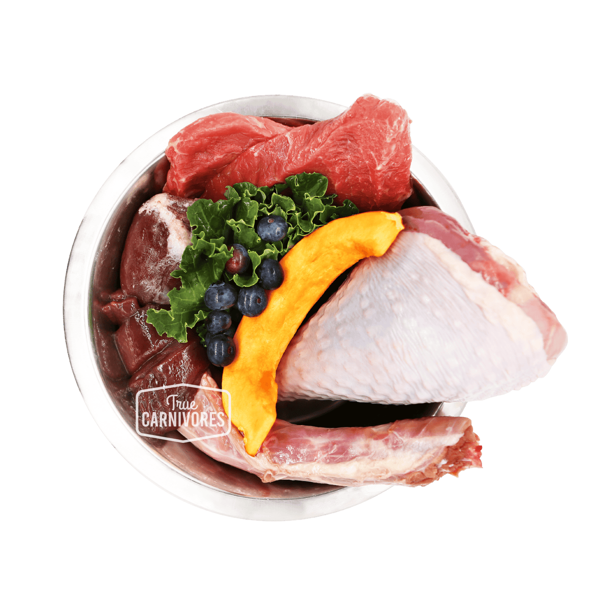 Stainless steel bowl of 100 Mile Raw Turkey Dinner with raw turkey, beef organs, kale, pumpkin, and blueberries, branded True Carnivores for pets.
