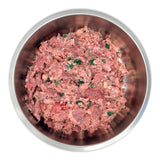 Big Country Raw XL Beef in a stainless-steel bowl, showcasing coarsely ground beef and pork with green herbs, ideal for large-breed dogs.