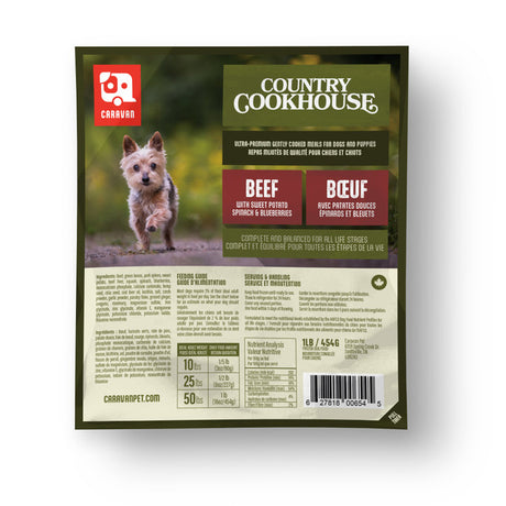 Caravan Country Cookhouse Beef dog food pouch with terrier image, flavor description, feeding guide, and bilingual ingredient list, complete for all life stages.