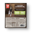 Caravan Country Cookhouse Chicken dog meal pouch, featuring a running dog graphic, nutrition details, and instructions for a complete, balanced canine diet.
