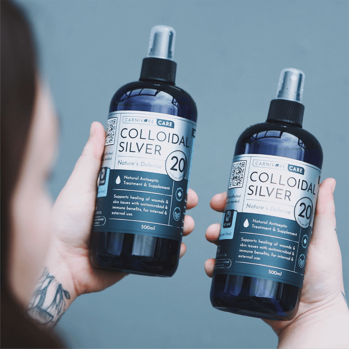 Carnivore Care Colloidal Silver Spray 20PPM 500mL Bottle held in hands, labeled for natural antiseptic and antimicrobial use for pets' skin and wound healing.