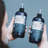 Carnivore Care Colloidal Silver Spray 20PPM 500mL Bottle held in hands, labeled for natural antiseptic and antimicrobial use for pets' skin and wound healing.