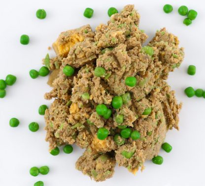 Tom & Sawyer Kangaroo: Moist, ground meat with peas, resembling wet pet food. Lean, gently cooked, bowl-ready meal for dogs, vacuum-sealed for easy storage and serving.