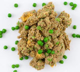 Tom & Sawyer Kangaroo: Moist, ground meat with peas, resembling wet pet food. Lean, gently cooked, bowl-ready meal for dogs, vacuum-sealed for easy storage and serving.