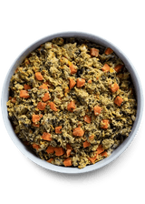 Open Farm Gently Cooked Harvest Chicken Recipe in a white bowl, featuring a scrambled mix of carrots, leafy greens, and moist vegetable mash for dogs.