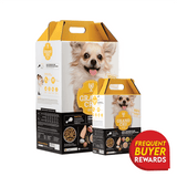 Two cartons of Grand Cru Chicken & Duck for Dogs, featuring a happy dog and a Frequent Buyer Rewards badge, showcasing its freeze-dried, easy-serve poultry formula.