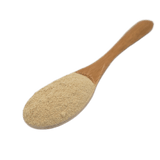 Wooden spoon with Carnivore Care Green-Lipped Mussel powder, recommended for joint pain and arthritis relief in dogs, available in a 250g package.