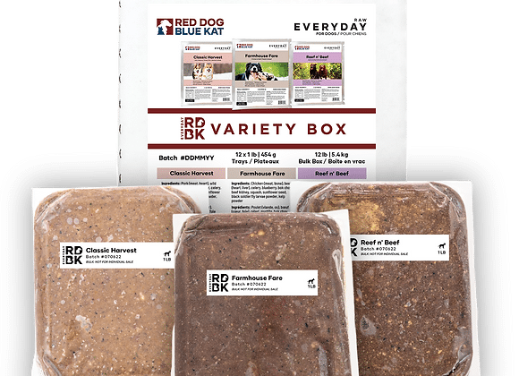 RDBK Everyday Raw Variety Box showing a printed insert and three vacuum-sealed 1 lb raw-food pucks: Classic Harvest, Farmhouse Fare, Reef n’ Beef.