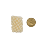 Back 2 Basics Calamari Florets 500g, small scored squid piece beside a loonie for scale, showcasing its compact size and pet-friendly design.