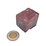 Bulk Beef Liver Bites - Frozen Raw Add-On shown as a 2-3 cm reddish cube beside a toonie for scale, ideal for pet diets or treats.