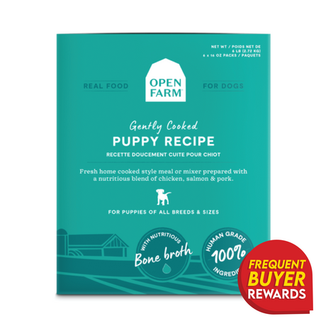 Open Farm Gently Cooked Puppy Recipe packaging showcasing chicken, salmon, and pork meal in bone broth. Features human-grade ingredients for puppies, with a rewards badge.