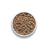Rawbble Pork Recipe for Dogs: A white bowl filled with freeze-dried, brown pork nuggets, ideal for serving dry or rehydrated as a complete meal or topper.