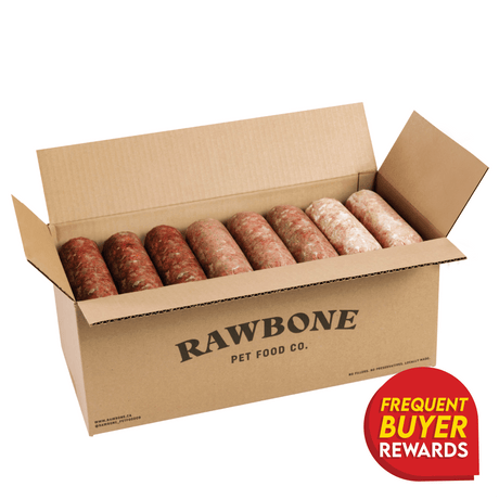 Rawbone Variety Box (Beef, Pork & Turkey) in an open branded box with eight meat logs, highlighting freezer-friendly, minimally processed raw pet food and a rewards badge.