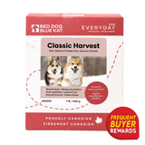 Front of RDBK Everyday Raw Classic Harvest box, featuring pork, salmon, turkey blend, two corgis in snow, Canadian branding, and a Frequent Buyer Rewards badge.