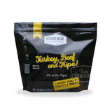 Butcher Blend Turkey, Beef with Tripe for Dogs in a 5 lb black and yellow pouch, highlighting probiotics, minerals, and coarse-ground texture for hearty meals.